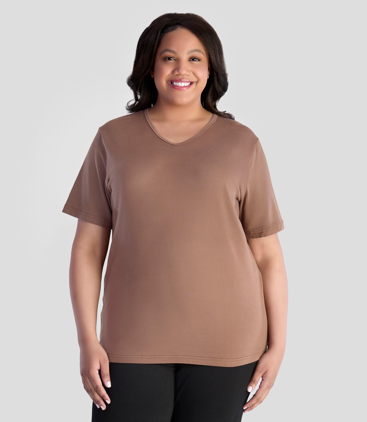 JunoActive model wearing EasyLuxe Classics V-Neck Top  in color cafe latte. Model is facing forward with her arms by her side.