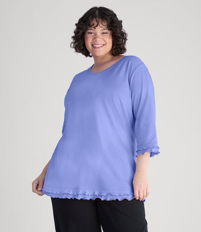 Model, facing front, wearing cotton chic lettuce trim 3-4 sleeve plus size top in color periwinkle.
