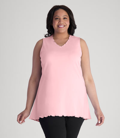 Model, facing front, wearing JunoActive's Cotton Chic Let's Trim Sleeveless plus size top in color peach blossom.