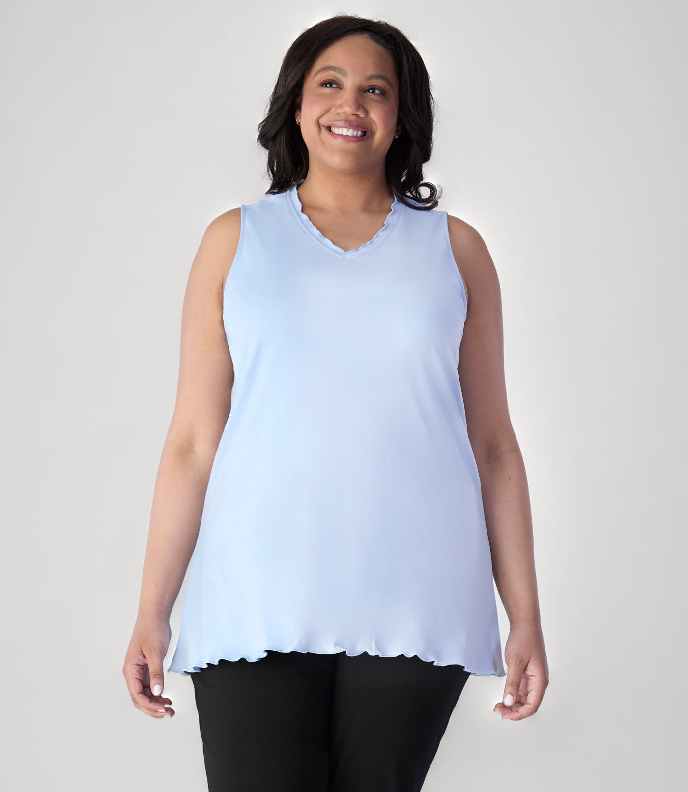 Model, facing front, wearing JunoActive's Cotton Chic Let's Trim Sleeveless plus size top in color sky blue.