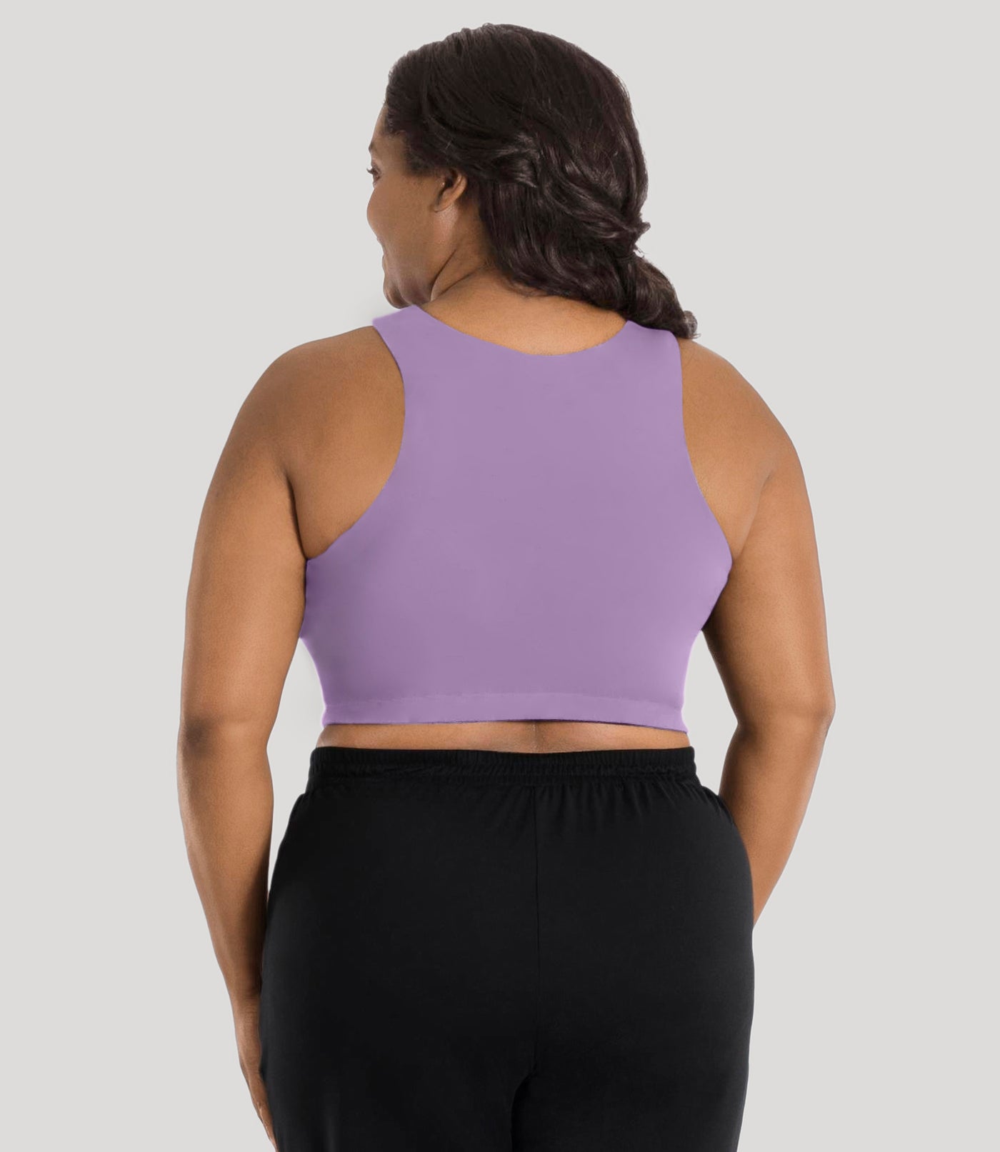 Plus size model, facing back, wearing stretch naturals full fit V-neck plus size bra in color lavender.
