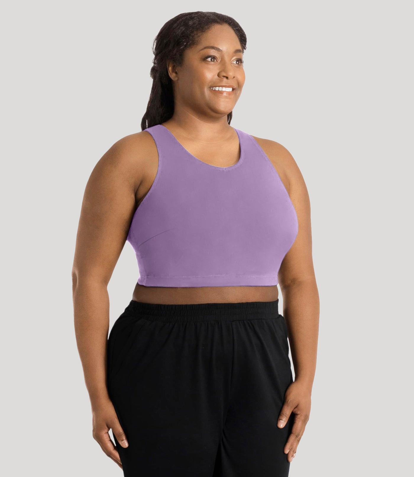 Plus size model, facing front, wearing stretch naturals full fit V-neck plus size bra in color lavender.