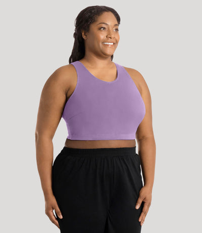 Plus size model, facing front, wearing stretch naturals full fit V-neck plus size bra in color lavender.