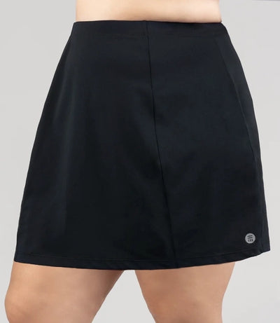 Close up of Model, facing forward, wearing JunoActive's Aquasport Swim Cover Skirt in color black.