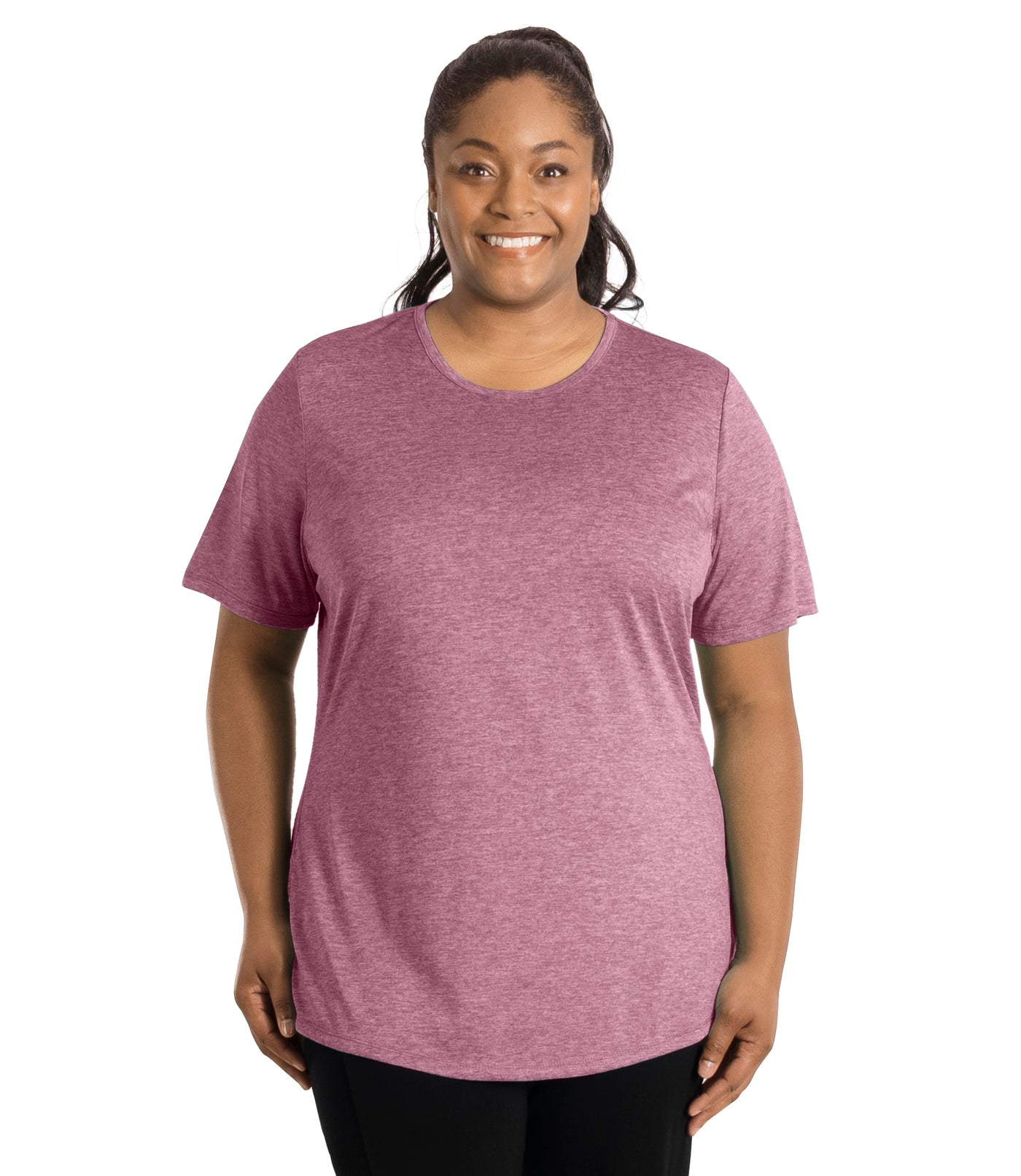 Plus size woman wearing JunoActive's SunLite Scoop Neck  front view wearing black pants and hands by side in heather ruby.