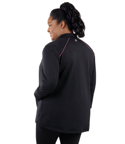 Plus size woman, facing back, wearing JunoActive's JunoStretch Mock Neck Jacket in color black with warm mauve lining cuffs and warm mauve piping details along shoulders and pockets. 