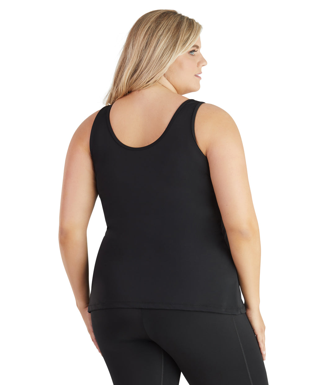 Plus size model, back view, wearing QuikEnergy Tankini Swim Top Hibiscus print. Scoop back in solid black.