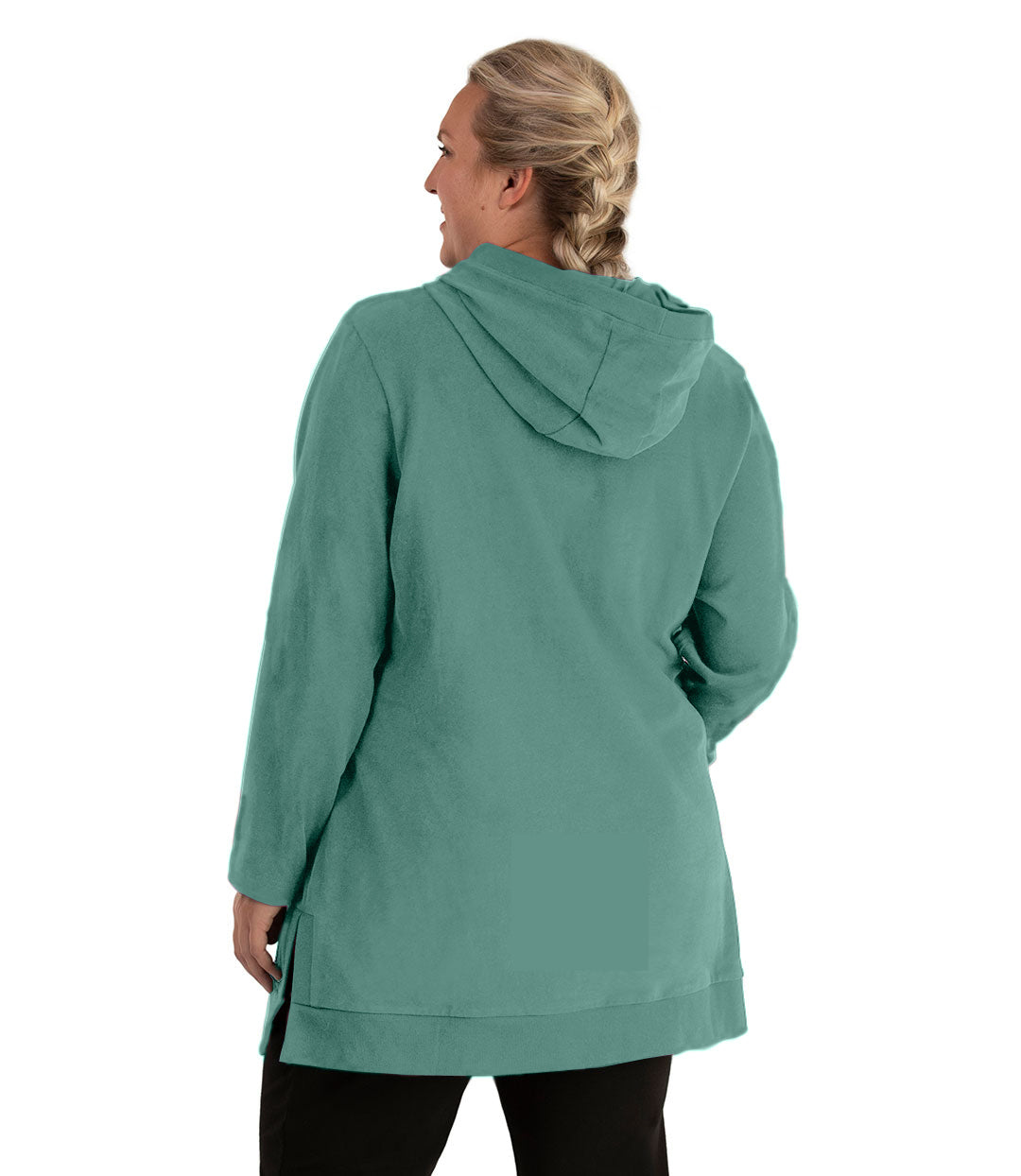 Plus size woman, facing back looking left, wearing JunoActive plus size Legacy Cotton Casual Pullover V-Neck Hoodie in the color Lichen Green. She is wearing JunoActive Plus Size Leggings in the color Black.