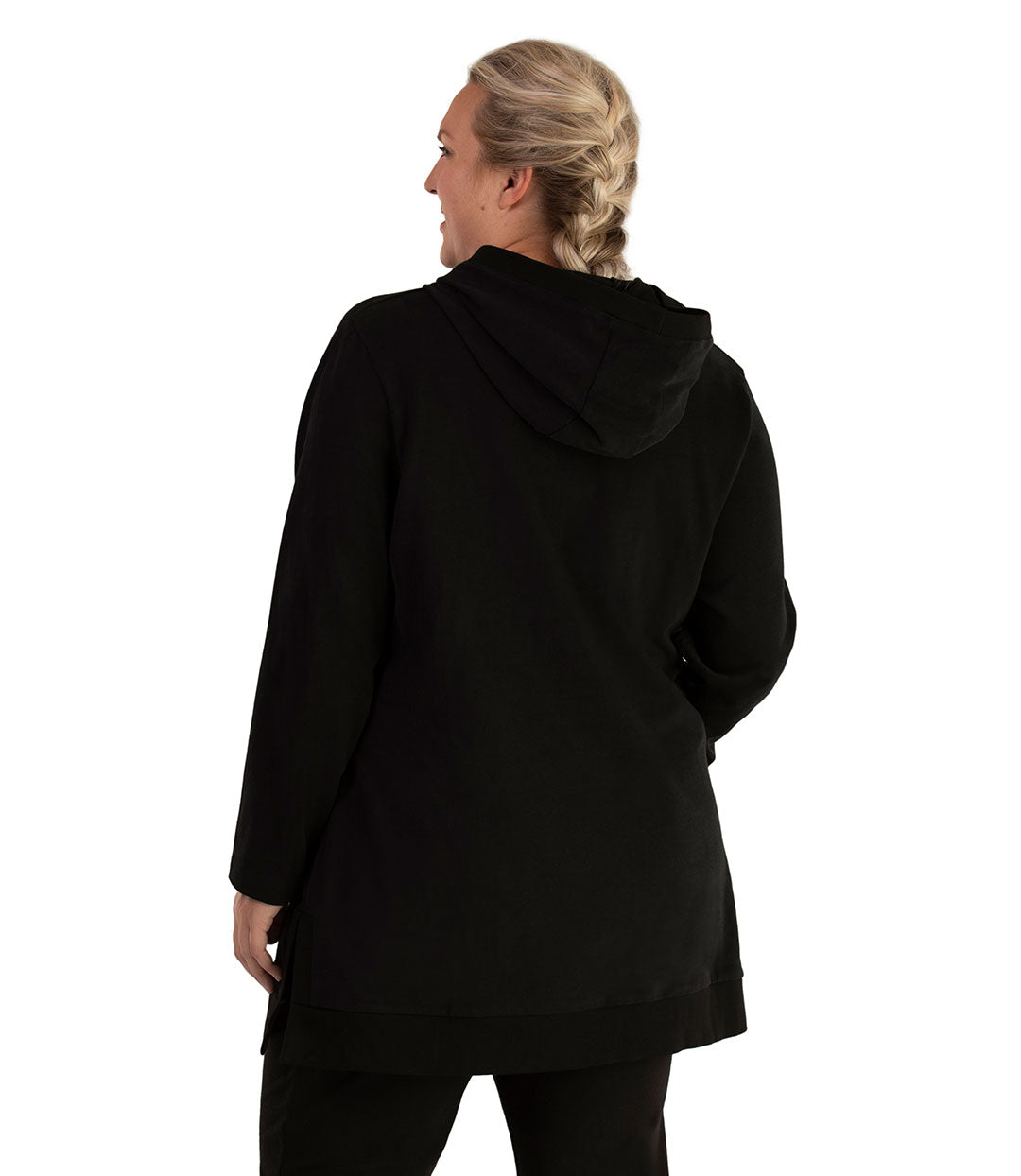 Plus size woman, facing back, wearing JunoActive plus size Legacy Cotton Casual Pullover V-Neck Hoodie in the color Black. She is wearing JunoActive Plus Size Leggings in the color Black.