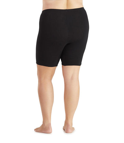 Plus size woman, back view, wearing JunoActive Junowear Cotton Stretch Fitted Boxer. The hemline is a few inches above knee in color black.
