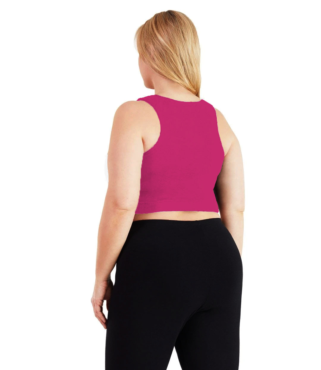 Plus size woman, facing back, wearing JunoActive plus size Stretch Naturals V-Neck Bra top in Geranium Pink. The woman is wearing black JunoActive plus size leggings. Her arms fall naturally to her side.