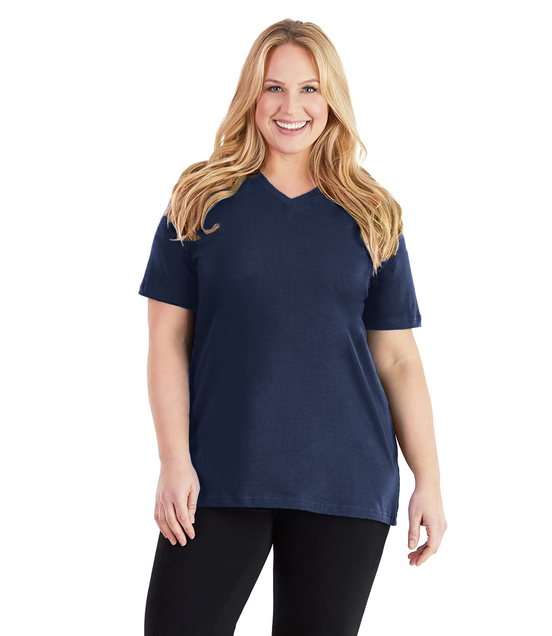 Plus size woman, facing front, wearing JunoActive plus size Stretch Naturals V-Neck in the color Navy Blue. She is wearing JunoActive Plus Size Leggings in the color black. 