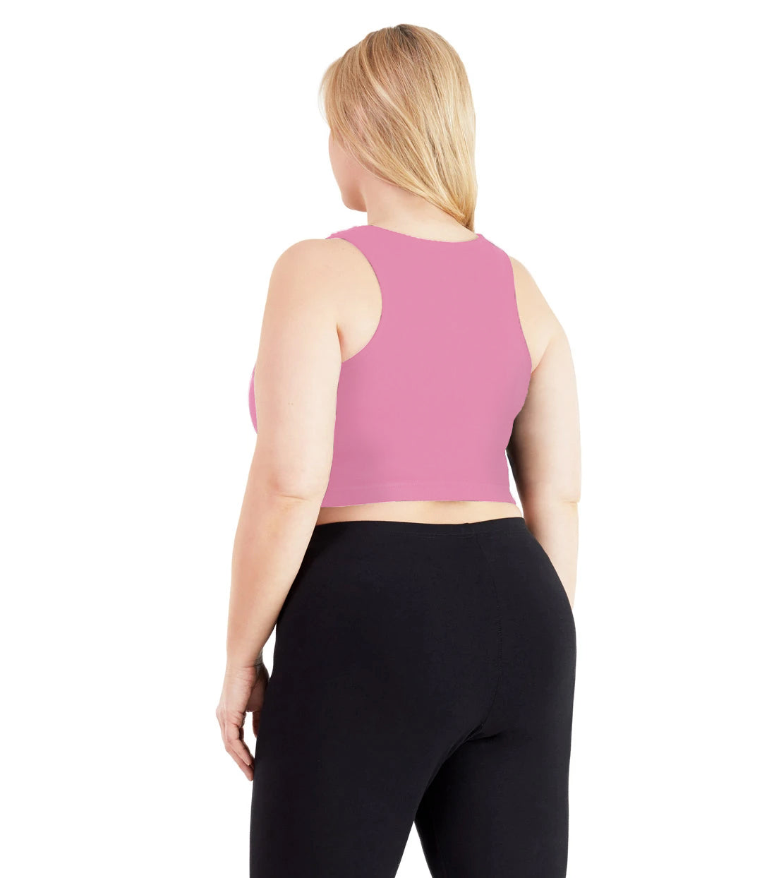 Plus size woman, facing back, wearing JunoActive plus size UltraKnit V-Neck Bras in Strawberry. The woman is wearing a pair of Black JunoActive leggings.