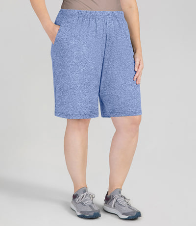 JunoActive Model, facing front, wearing 149216-SoftWik Relaxed Fit Shorts with her hand in her pockets in color heather royal.