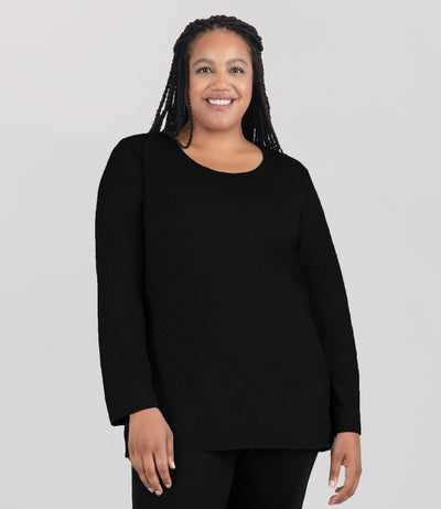 Model, facing front, wearing JunoActive's Softwick Long Sleeve Crew Neck Top in color black.
