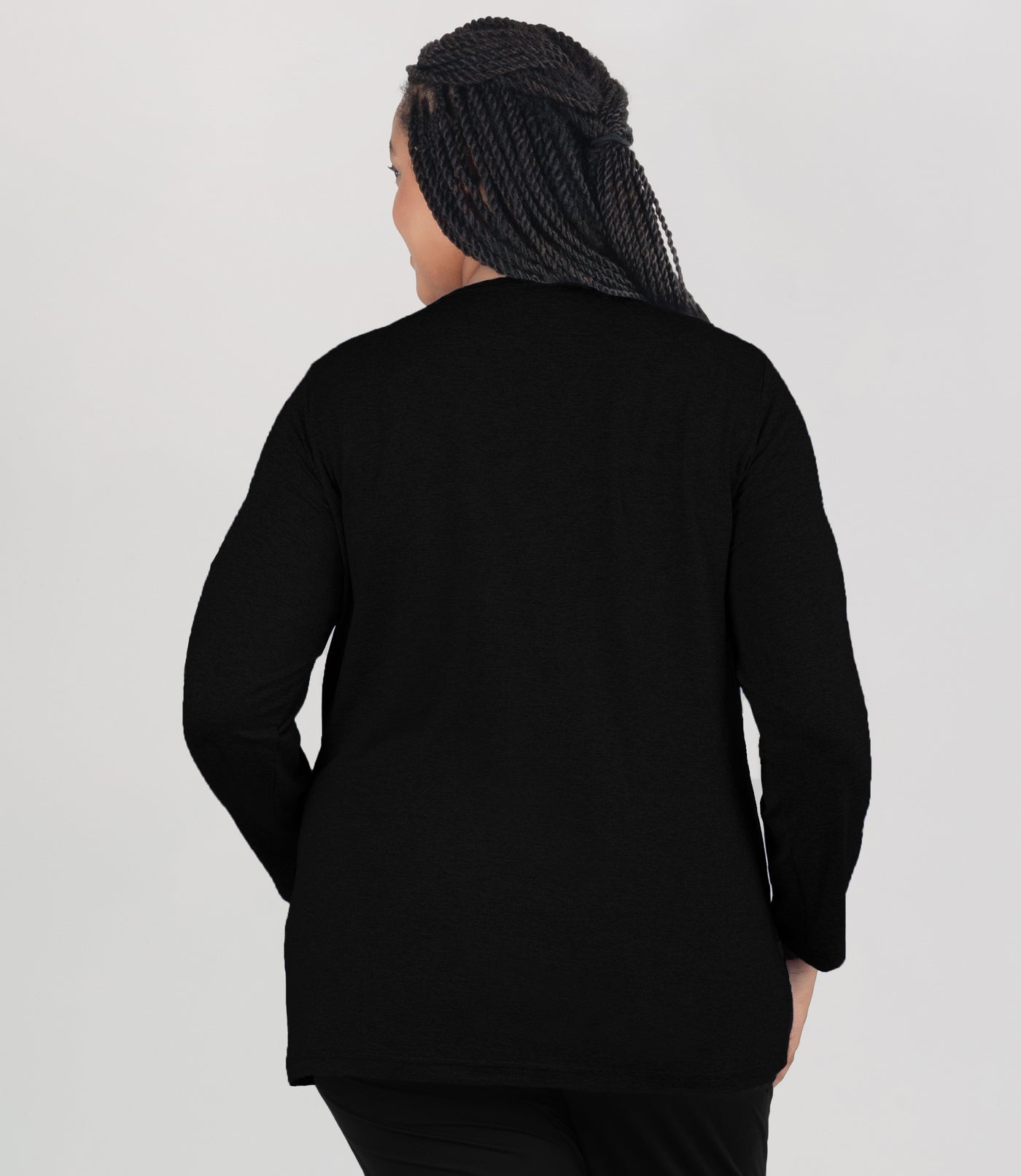 Model, facing back, wearing JunoActive's Softwick Long Sleeve Crew Neck Top in color black.