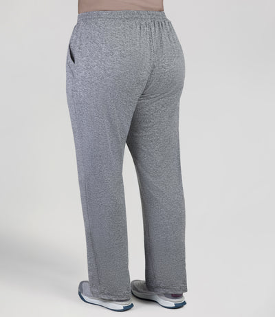 back view, bottom half of plus sized woman, wearing JunoActives Softwik Relaxed fit pocketed pant and is full length. Color is heather gray.