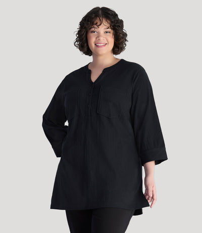 Plus size model, facing front, wearing EZ Style Cotton plus size 3/4 Sleeve Split Neck Tunic with Pockets in color black.