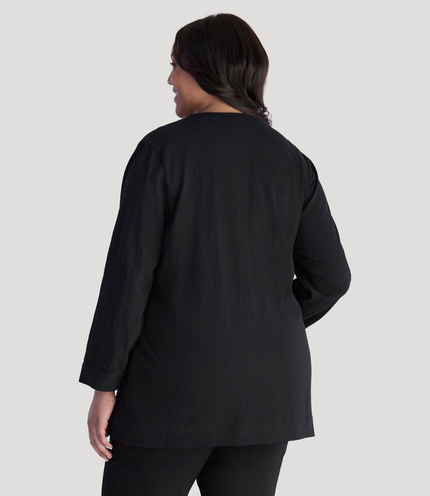 Model, facing back wearing JunoActive's Plus Size EZ Style Cotton Long Sleeve Pocket Jacket in color black.