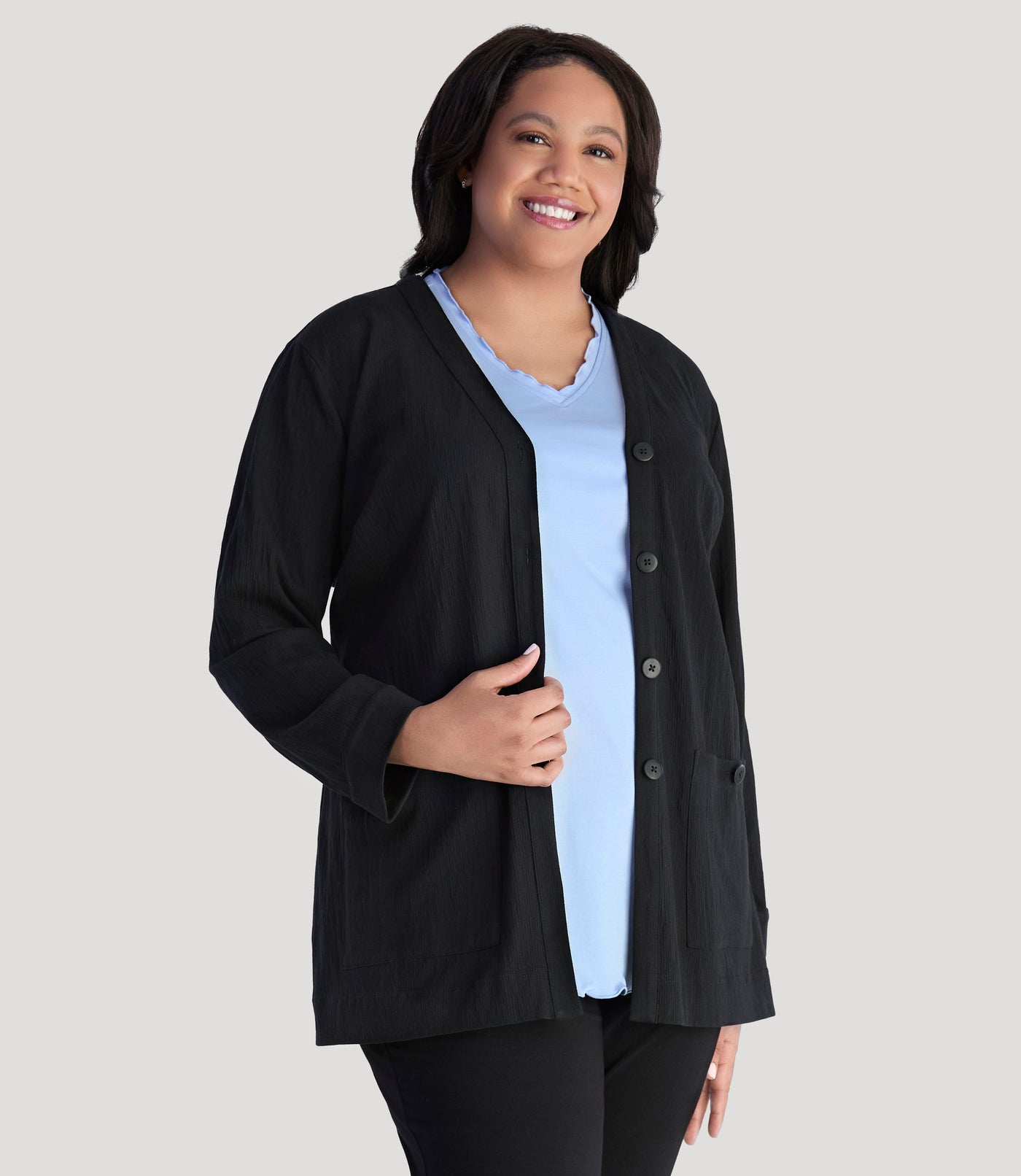Model, facing front, wearing JunoActive's Plus Size EZ Style Cotton Long Sleeve Pocket Jacket in color black.