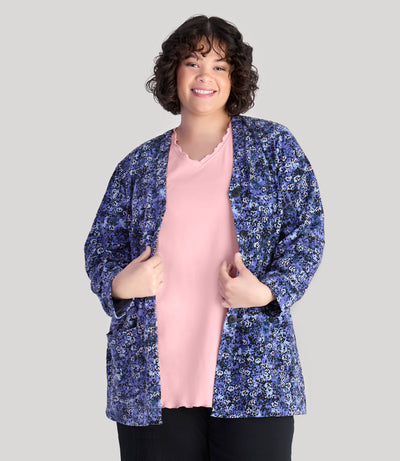 Model, facing front, wearing JunoActive's plus size EZ Style Cotton Long Sleeve Pocket plus size Jacket in color blue meadow print.
