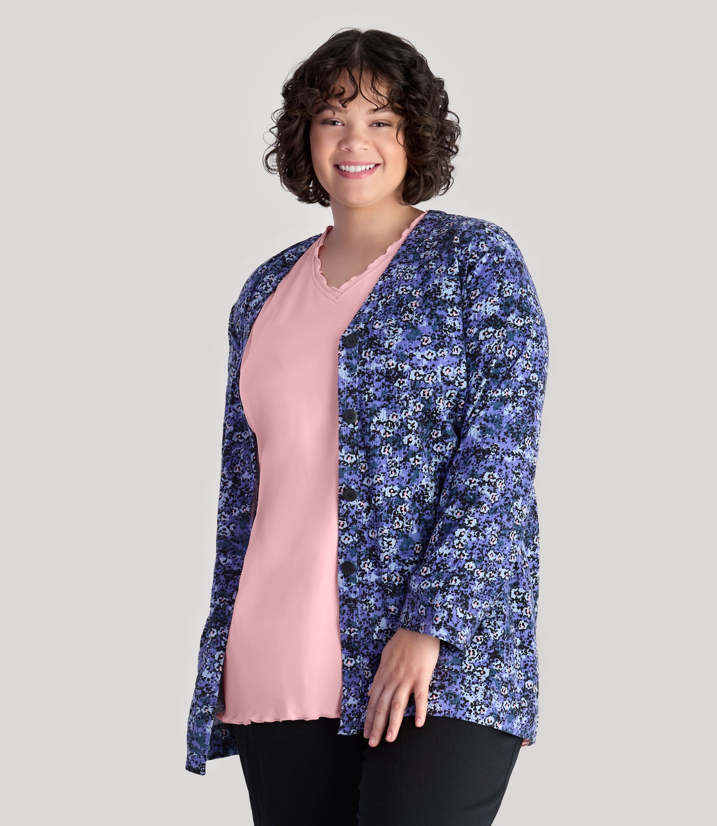 Model, facing front, wearing JunoActive's plus size EZ Style Cotton Long Sleeve Pocket plus size Jacket in color blue meadow print.