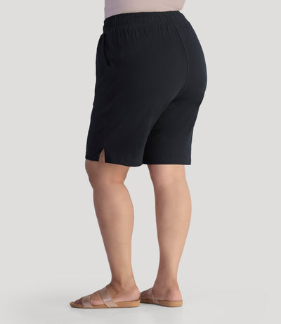 Plus size model, facing front, wearing EZ Style Cottons Pocketed plus size Short in black.