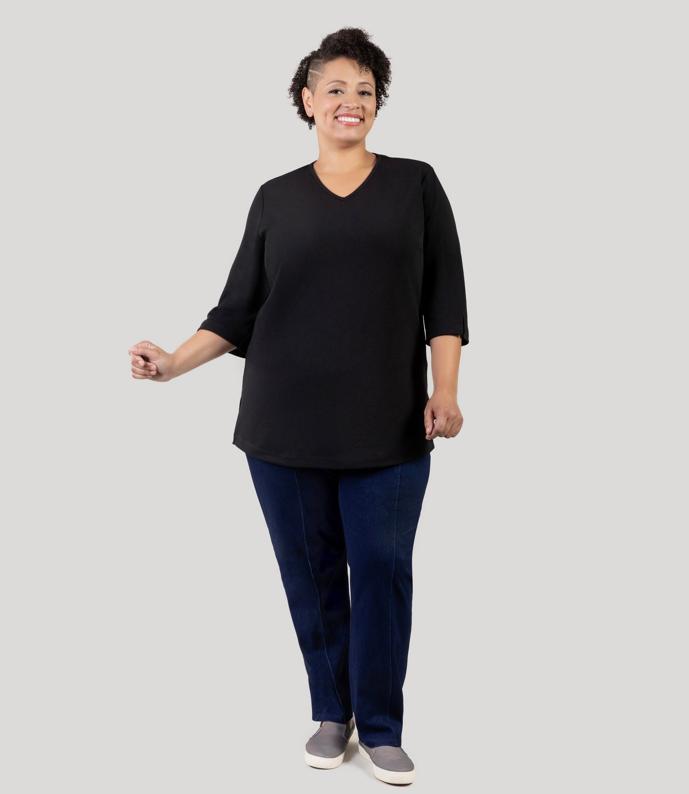 Plus Size Woman wearing Junonia Classic 3/4 Sleeve V-Neck Tunic black Plus Size top and twill plus size bottoms. Top features v-neck, 3/4 sleeves and vent notches on each sleeve and side hem.