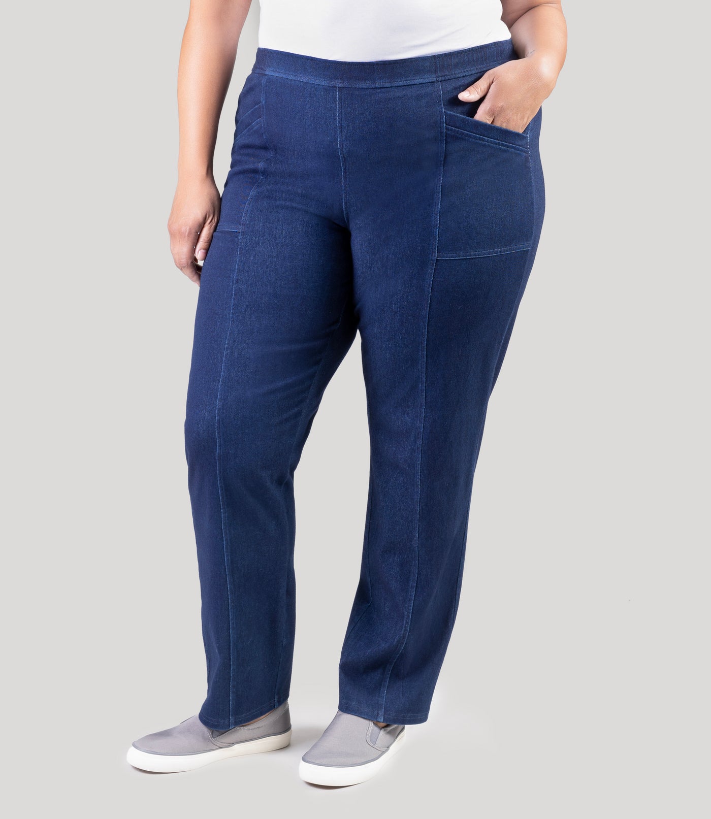 Plus size model, facing front, wearing Stretch Twill plus size pant in denim blue.