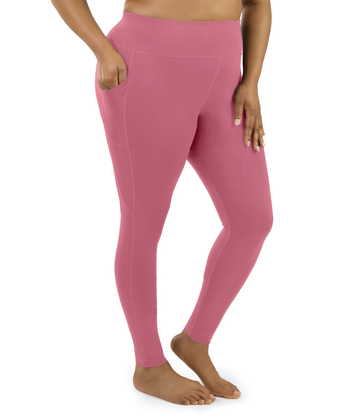 Bottom half of plus sized woman, facing front and angled to side, wearing JunoActive JunoStretch Side Pocket Legging in warm mauve. The pants are full length and have pockets on each side.