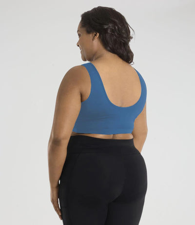 JunoActive model, facing front, wearing JunoStretch JunoStretch Scoop Neck Bra Top in color serenity blue. Model's hands are resting by side.
