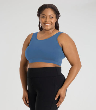 JunoActive model, facing front, wearing JunoStretch JunoStretch Scoop Neck Bra Top in color serenity blue. Model's hands are resting by side.
