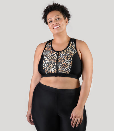 Plus size woman, facing front, wearing JunoActive's QuikEnergy Zip Front plus size Swim Bra featuring leopard print in front panels with full length zipper center front.