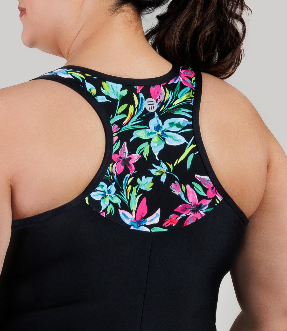 Plus size model, wearing JunoActive's QuikEnergy Racerback Zip Front plus size aquatard, facing back close up of details of the print and design of suit.