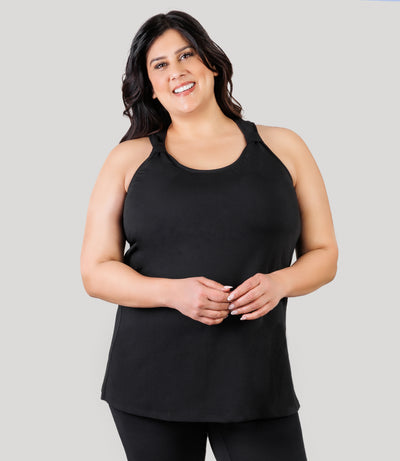 Plus size model, facing front, wearing JunoActive's AquaSport Hanalei Plus Size Tankini Top in color black.