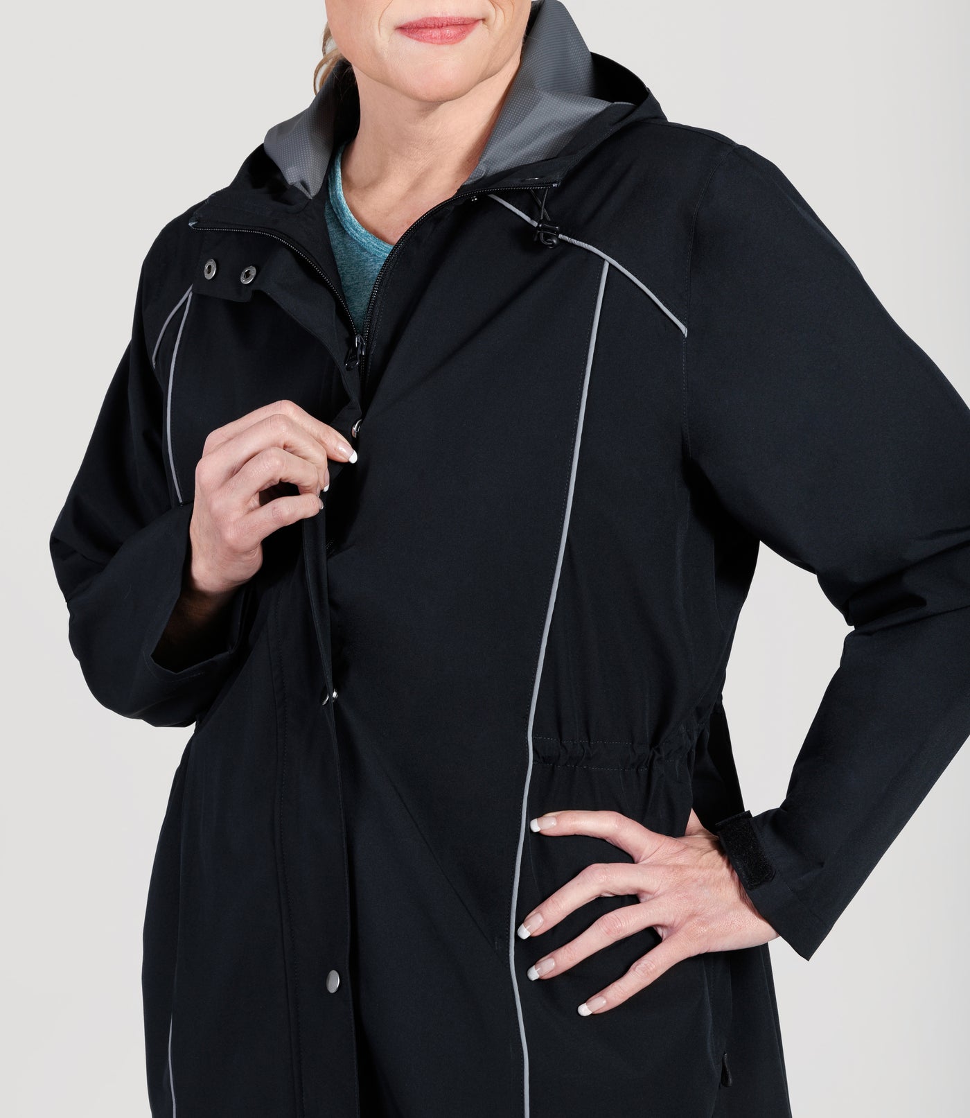 Plus size model, wearing JunoActive's Adventure Wind and Rain Jacket in color black, featuring design of jacket and fabric.