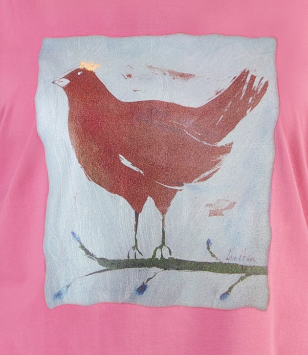 Close up of JunoActive’s Stretch Naturals Lite 3/4 Sleeve V-neck Tunic chicken with a crown graphic.