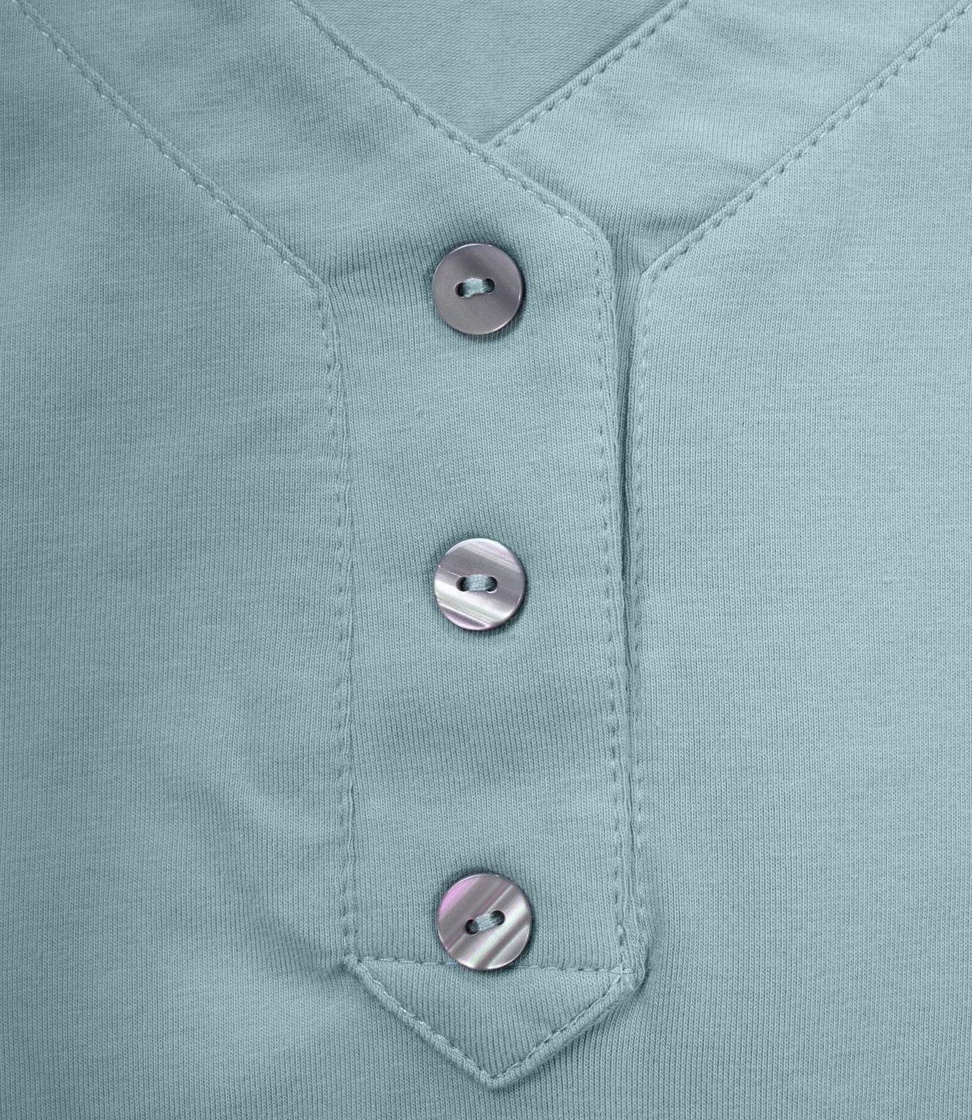 Close up of buttons on JunoActive Stretch Naturals Lite 3/4 Sleeve Button Henley in calm jade.