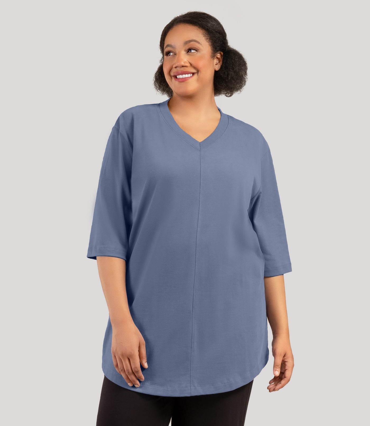 Plus size model, facing front, wearing JunoActive's Legacy Cotton Casual plus size tunic top in color blue steel.