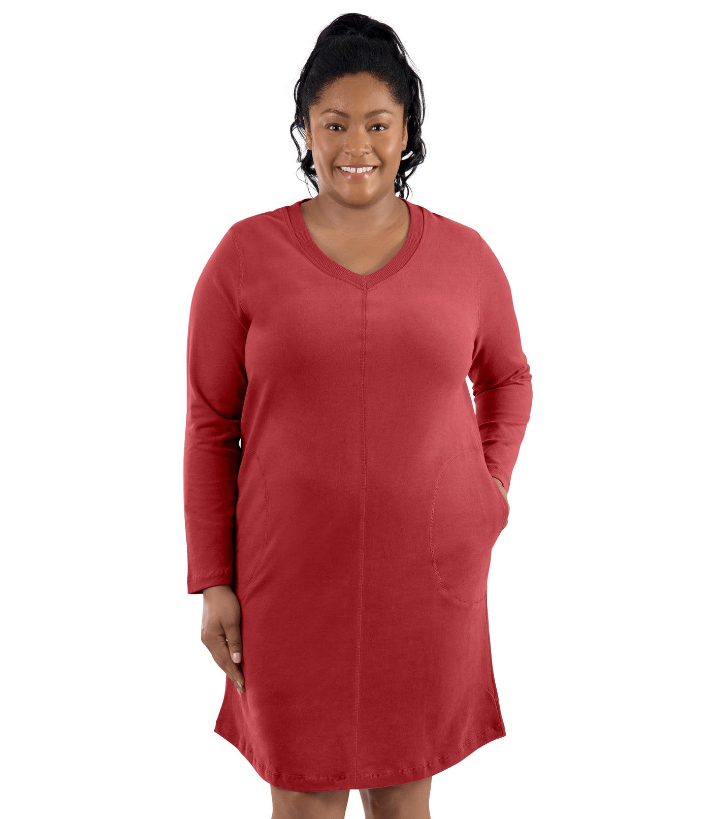 Plus-size model, facing forward, left hand in dress pocket. Wearing JunoActive's Legacy Cotton Casual Pocketed Long Sleeve Dress in Sedona red.