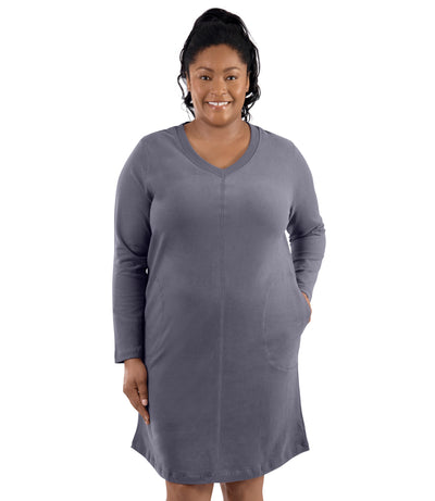 Plus-size model, facing forward, left hand in dress pocket. Wearing JunoActive's Legacy Cotton Casual Pocketed Long Sleeve Dress in Misty Grey.