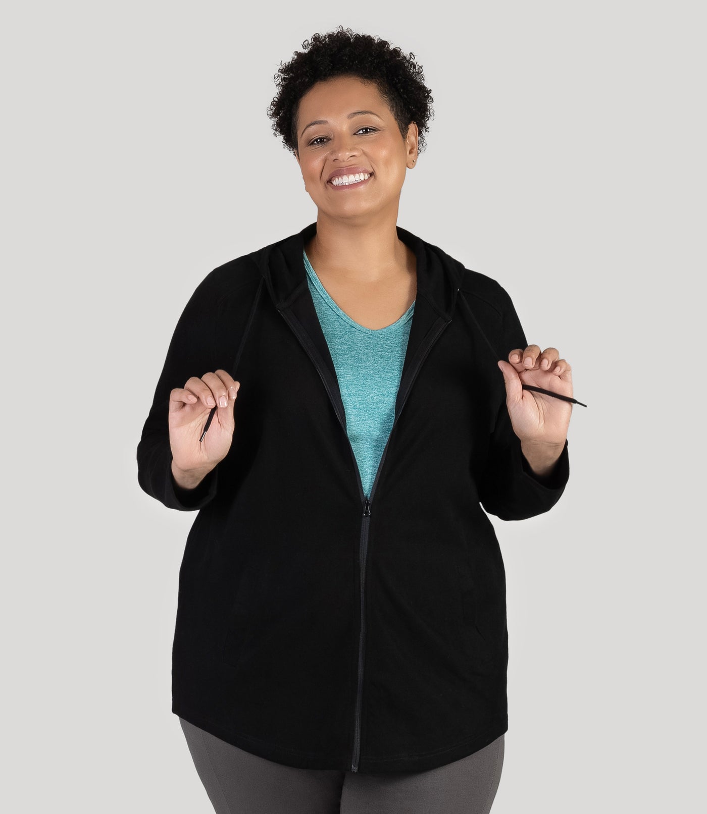 Plus size model, facing front, wearing JunoActive's Legacy Cotton Casual Zip Front plus size hoodie in color black.