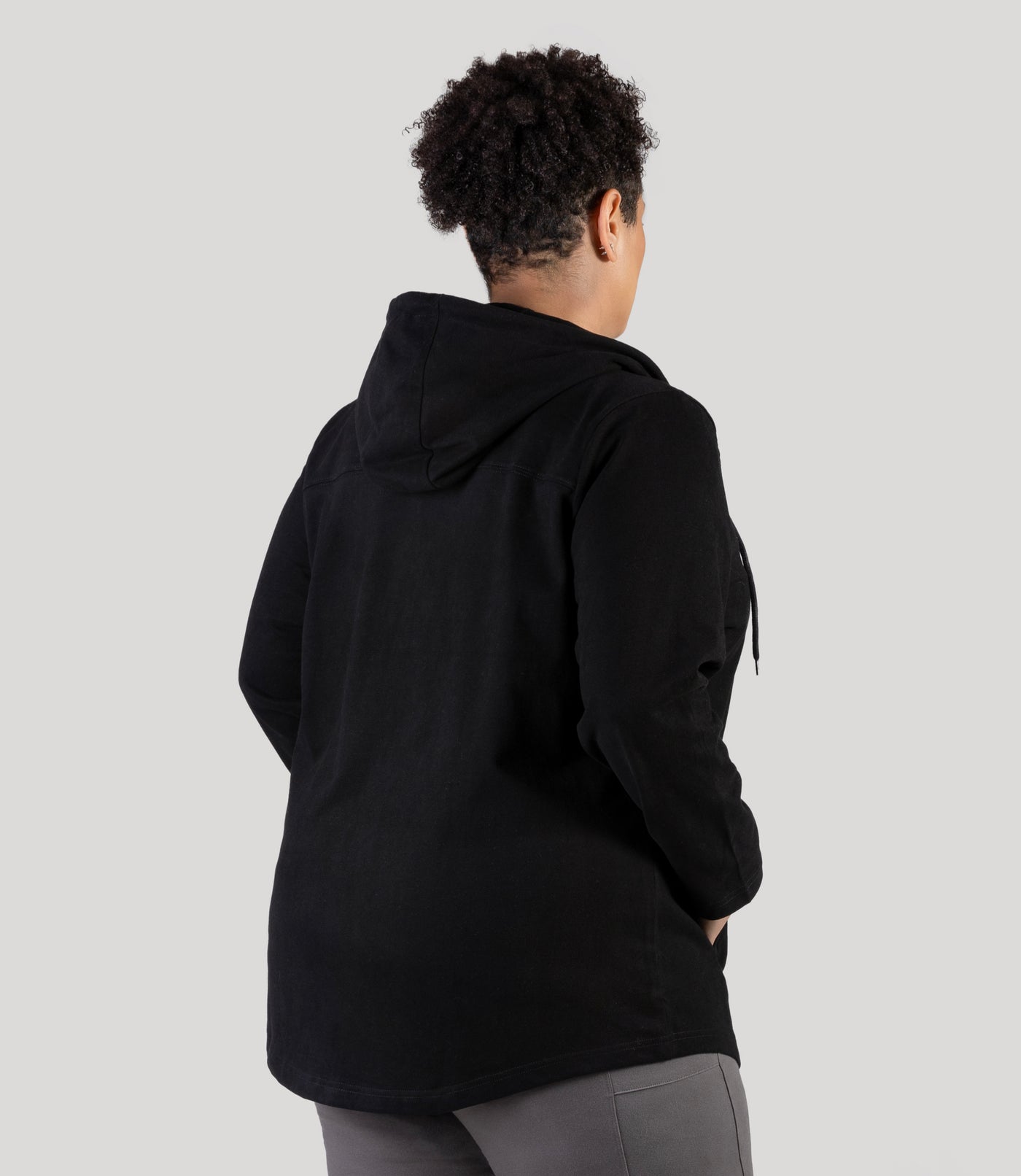 Plus size model, facing back, wearing JunoActive's Legacy Cotton Casual Zip Front plus size hoodie in color black.