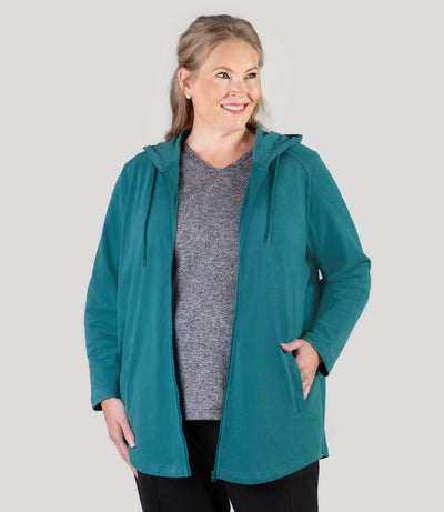 Plus size model, facing front, wearing JunoActive's Legacy Cotton Casual Zip Front plus size hoodie in color Jasper Teal.