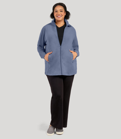 Plus size woman, facing front and full length shot, wearing JunoActive's Legacy Cotton Casual Mock Neck Zip up plus size jacket in color blue steel. Jacket is zipped.