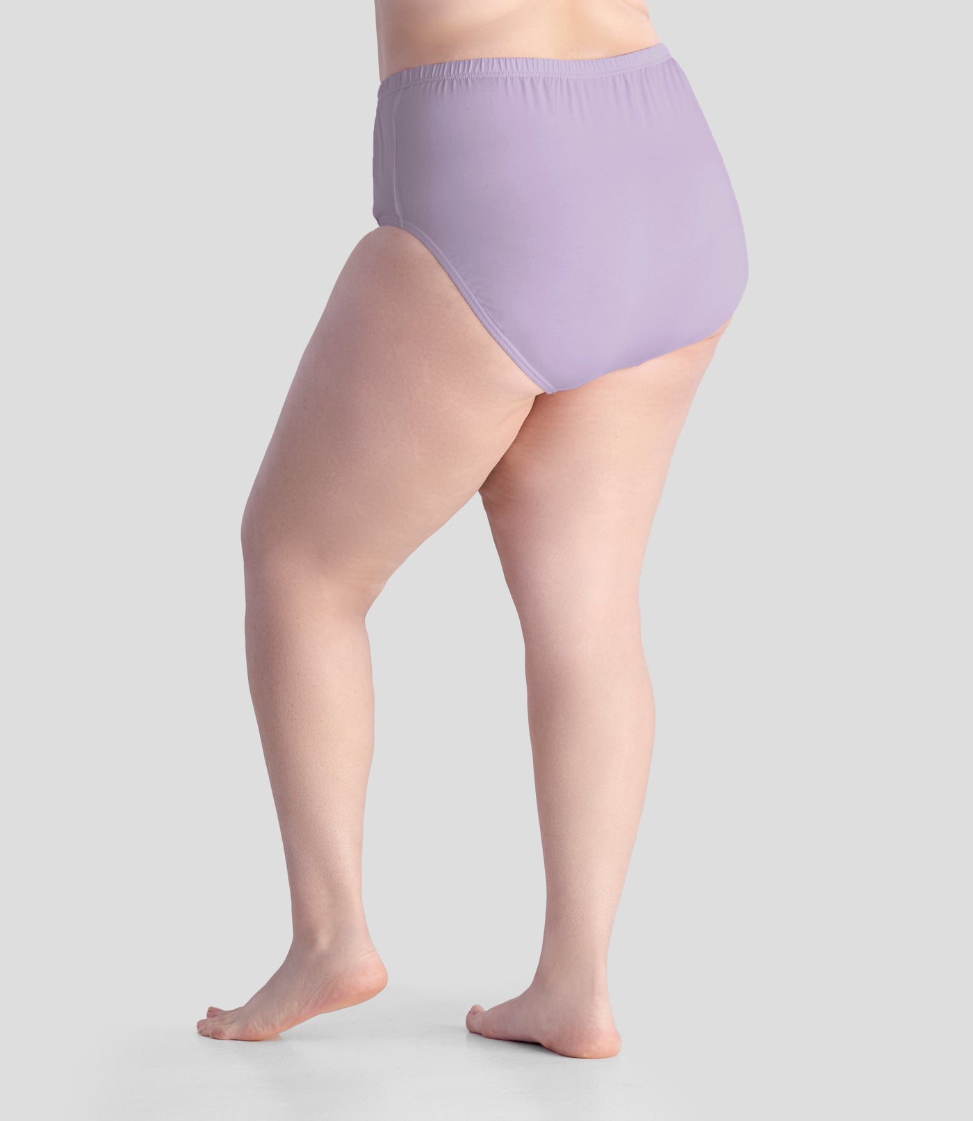Bottom half of plus sized woman, back view, wearing JunoActive Junowear Cotton Stretch Classic Brief in light purple. This brief fits to the waistline with conservative leg opening.