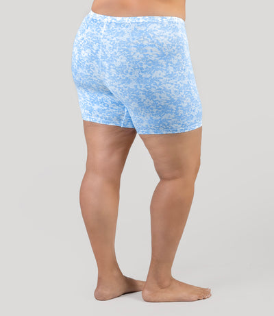 Lower half of plus size model, wearingJunowear Cotton Stretch Fitted Boxer Blue Blossoms Print, facing back.