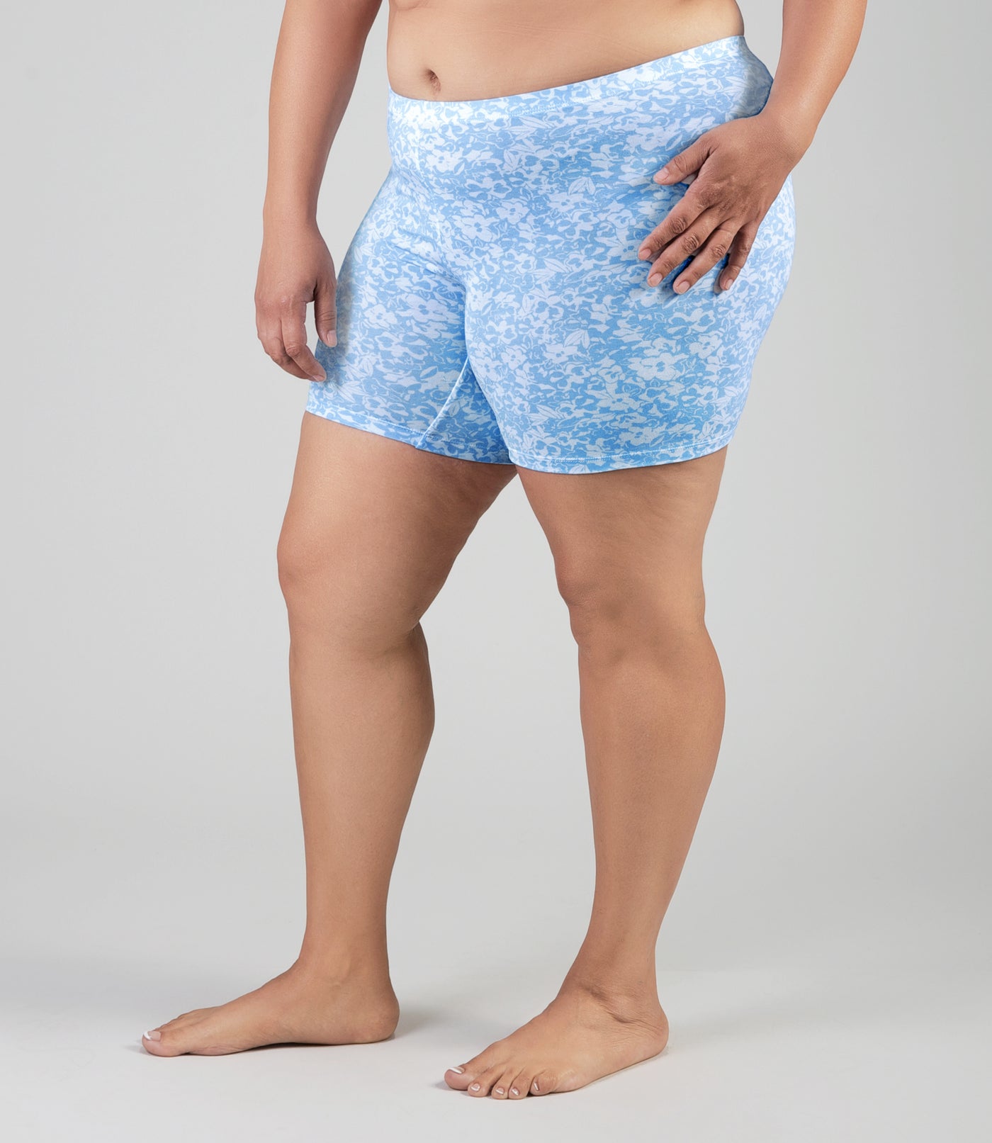 Lower half of plus size model, wearingJunowear Cotton Stretch Fitted Boxer Blue Blossoms Print, facing front.