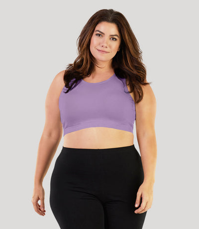 Plus size model, facing front, wearing stretch naturals Scoop Neck bra in color lavender.