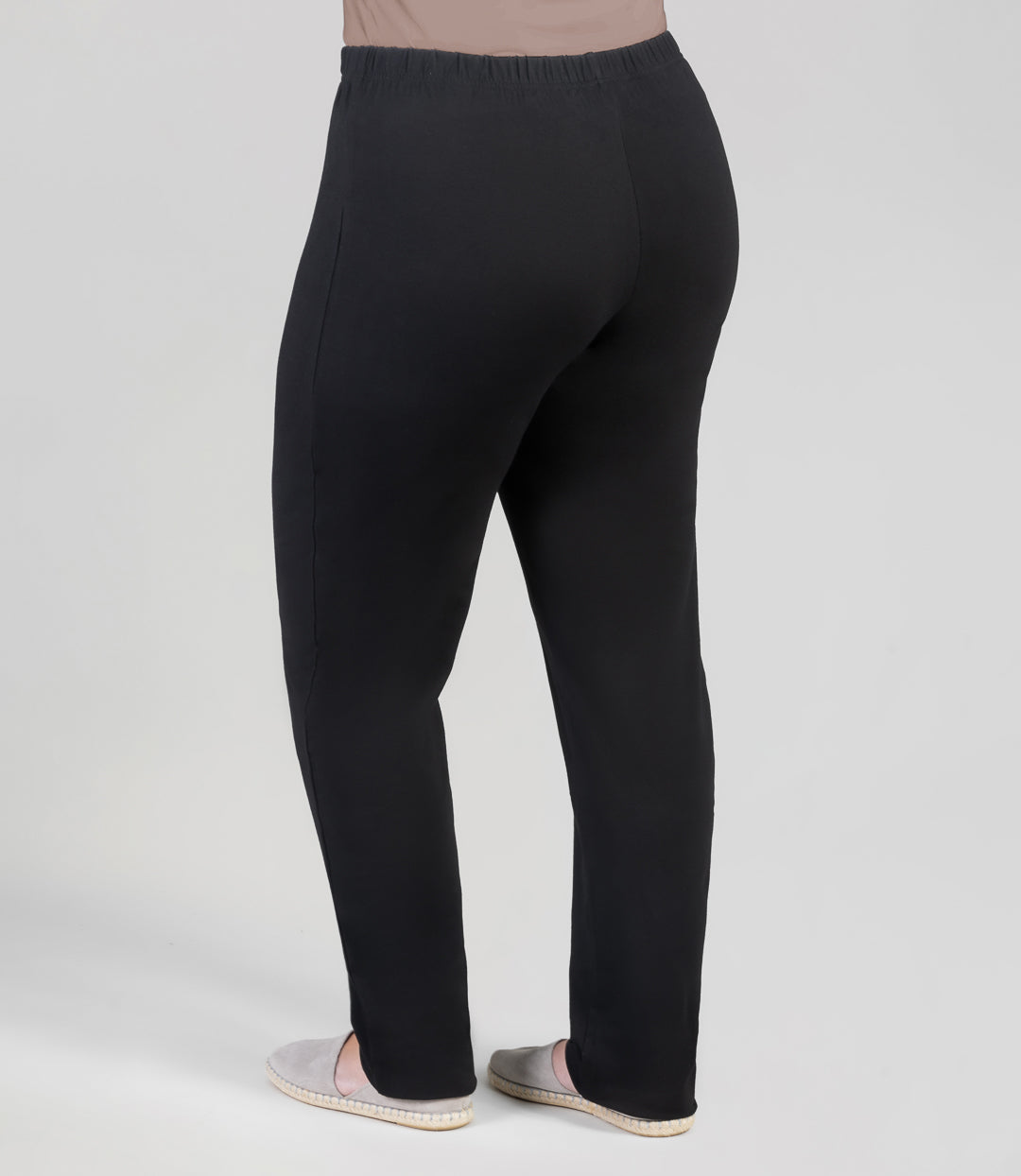 Back view, plus sized woman, wearing JunoActives Stretch Naturals Fit Leggings in black.The pant is full length.